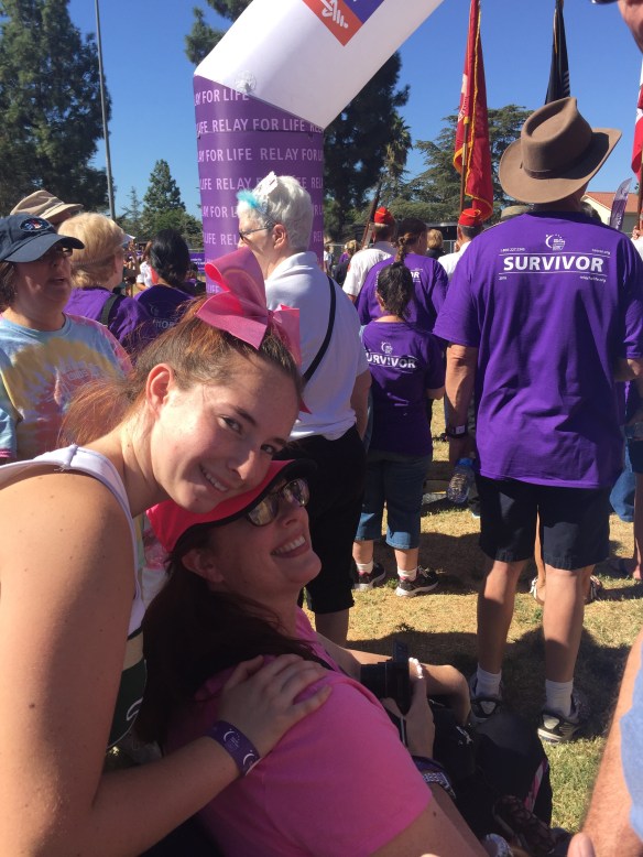In my wheelchair with Sam pushing. She's in her cheer uniform.